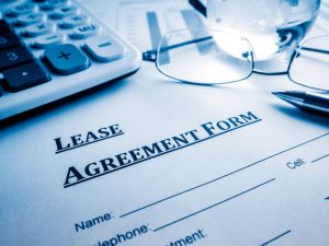 Lease agreement form on a desk.